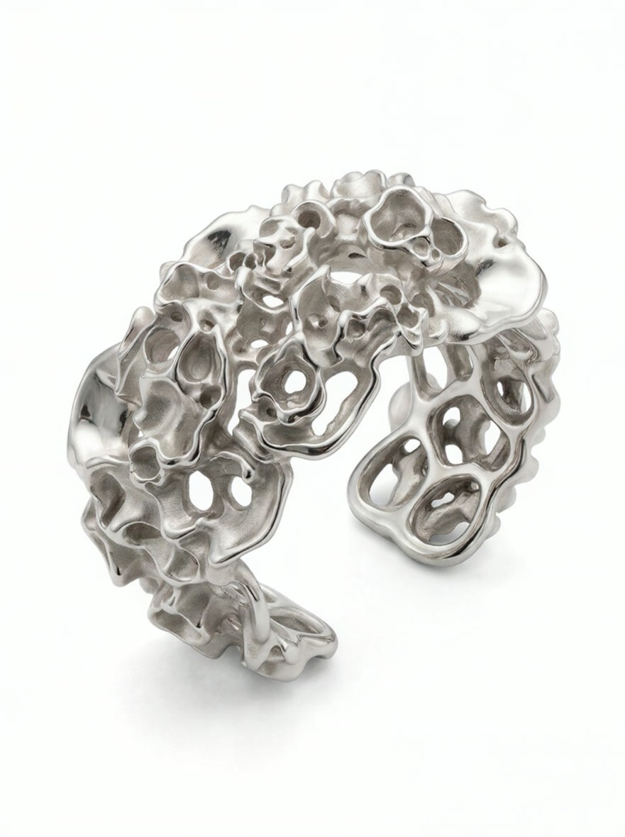 Render of a cuff built from a dense mineral cluster of pierced, encrusted nodules
