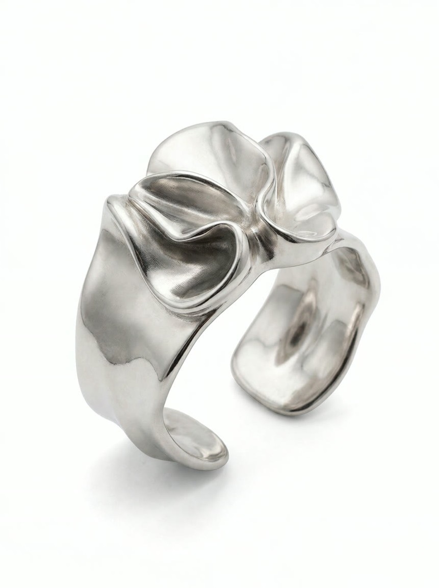 Render of a wide cuff whose surface is folded and draped like crushed sheet metal