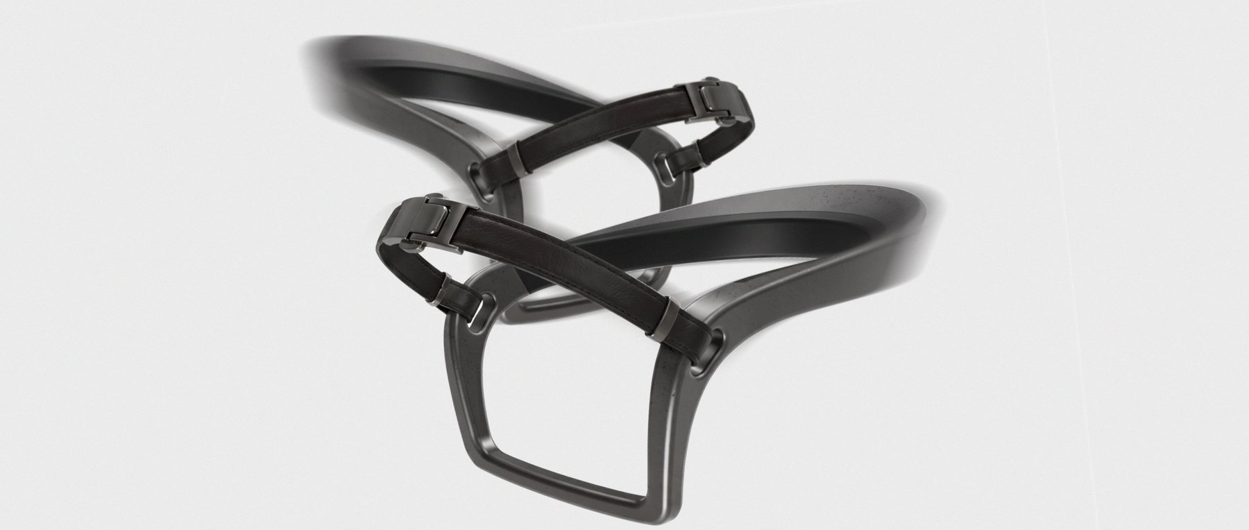 Two VeroSpurs in motion: continuous dark forms with woven straps and quick-release clasps