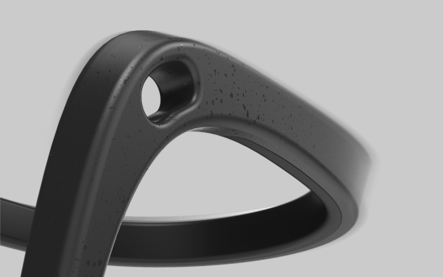 Close detail of the spur&rsquo;s continuous rounded body and strap slot